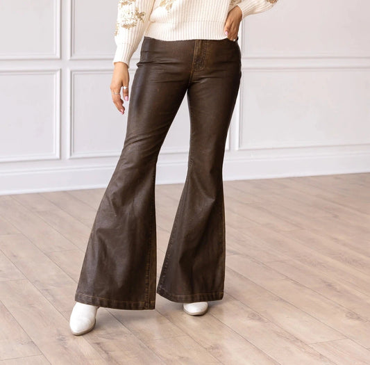 High-Rise Leather Flare Pants are a chic and edgy addition to your wardrobe. Designed with a fitted silhouette through the waist and hips, these pants feature a high-rise waistline, a zipper fly, and a dramatic flared leg.