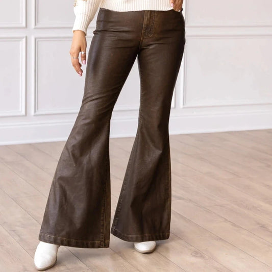 High-Rise Leather Flare Pants are a chic and edgy addition to your wardrobe. Designed with a fitted silhouette through the waist and hips, these pants feature a high-rise waistline, a zipper fly, and a dramatic flared leg.