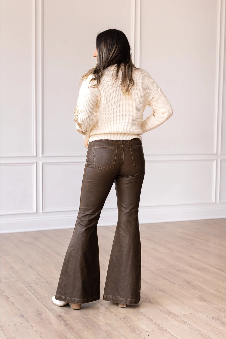High-Rise Leather Flare Pants are a chic and edgy addition to your wardrobe. Designed with a fitted silhouette through the waist and hips, these pants feature a high-rise waistline, a zipper fly, and a dramatic flared leg.