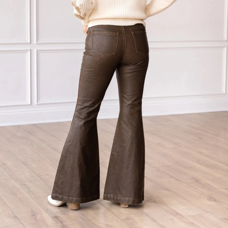 High-Rise Leather Flare Pants are a chic and edgy addition to your wardrobe. Designed with a fitted silhouette through the waist and hips, these pants feature a high-rise waistline, a zipper fly, and a dramatic flared leg.