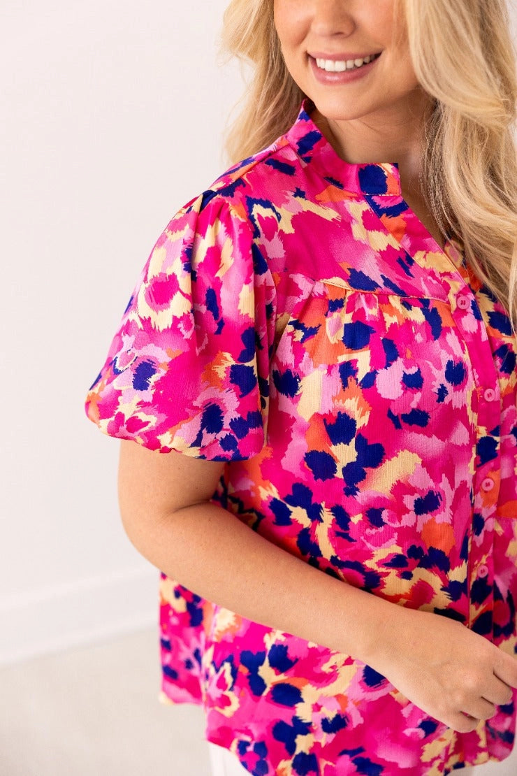 Floral Blouse is a vibrant and stylish addition to your wardrobe. Designed with a button-front closure and chic puff sleeves.