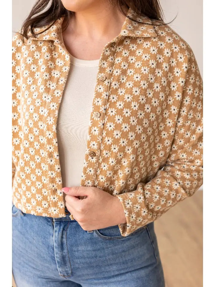 Floral Cropped Jacket is a versatile and stylish addition to your wardrobe. Featuring a charming daisy print and a cropped fit.