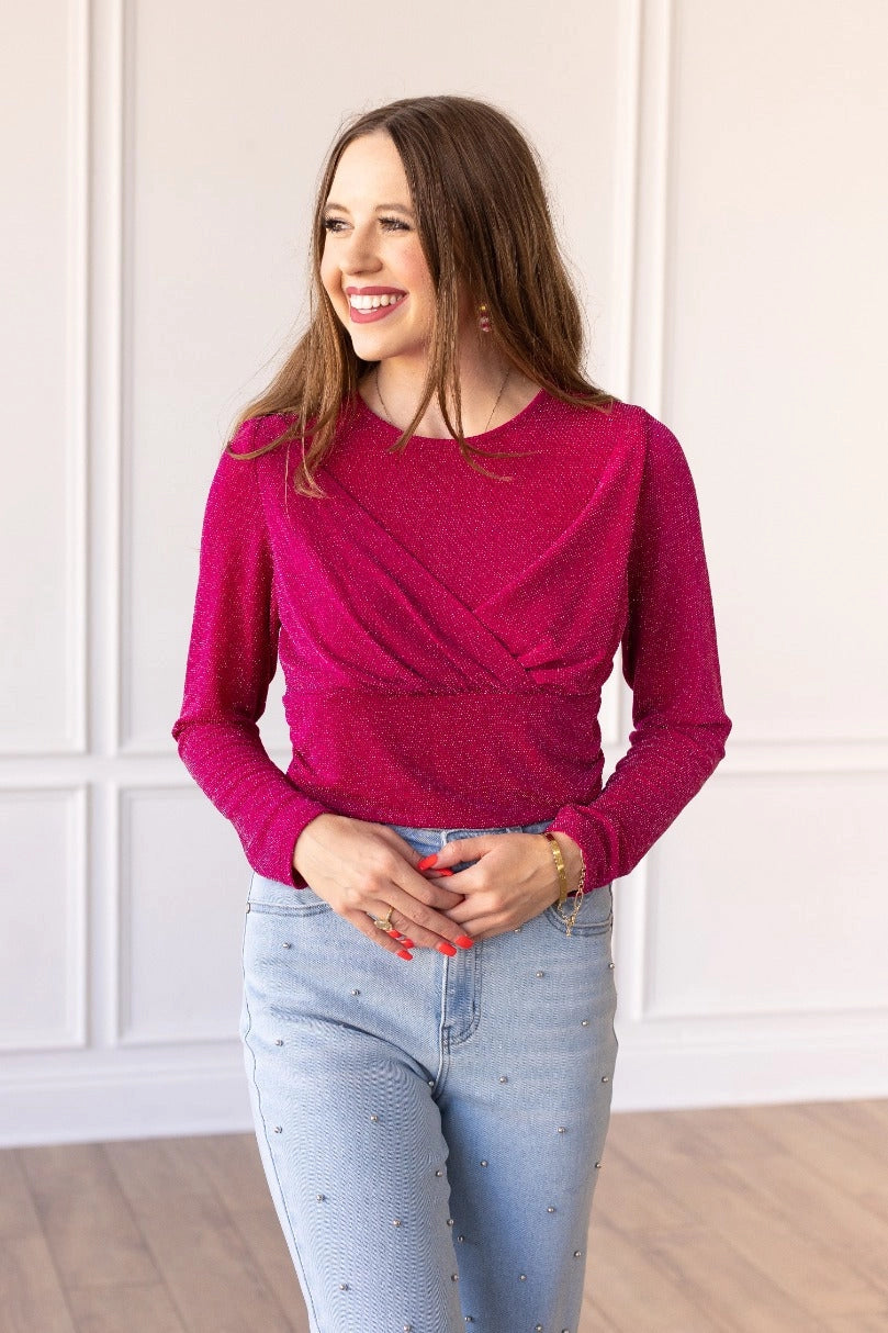 Hot Pink Sparkle Bodysuit brings a touch of elegance and shimmer to your wardrobe. Featuring a crew neck, high stretch fabric, and snap closure for easy wear.