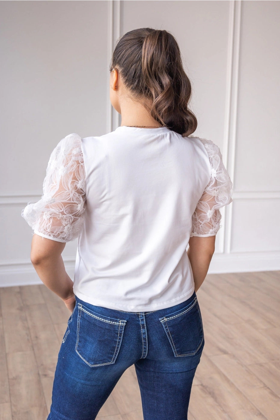 White Lace Puff Sleeve Top is a perfect combination of elegance and simplicity. Featuring delicate sheer lace puff sleeves and a classic boat neckline.