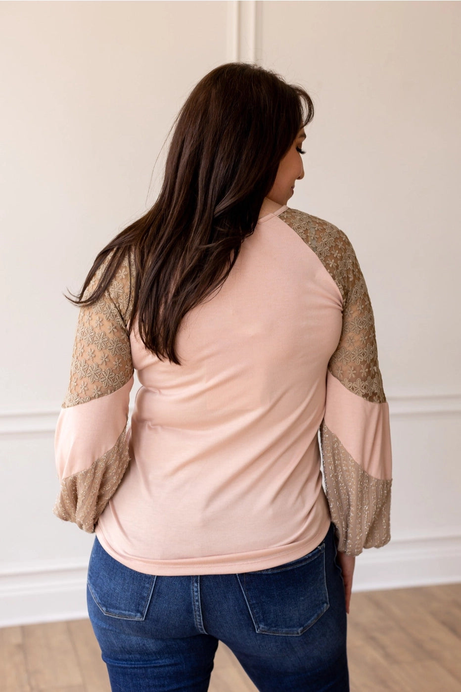 Lace Sleeve Top is a perfect blend of comfort and elegance. Featuring a relaxed fit, this top is designed with delicate lace balloon sleeves.