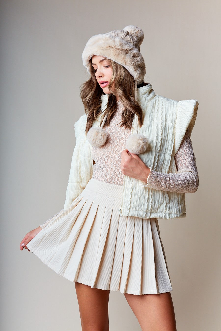 Quilted High-Collar Vest is the ultimate blend of warmth, comfort, and style. Crafted from cozy cable-quilted fabric.