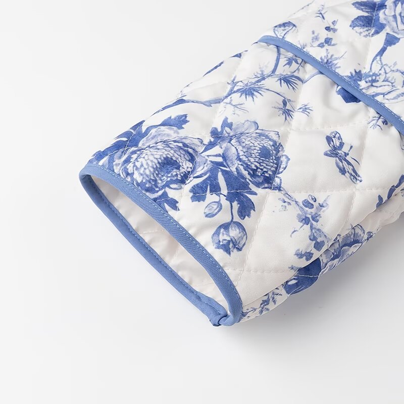 Blue Floral Quilted Jacket is a timeless and elegant piece that offers both style and comfort. Featuring a classic blue-and-white floral pattern, this lightweight quilted jacket is perfect for layering during cooler seasons.