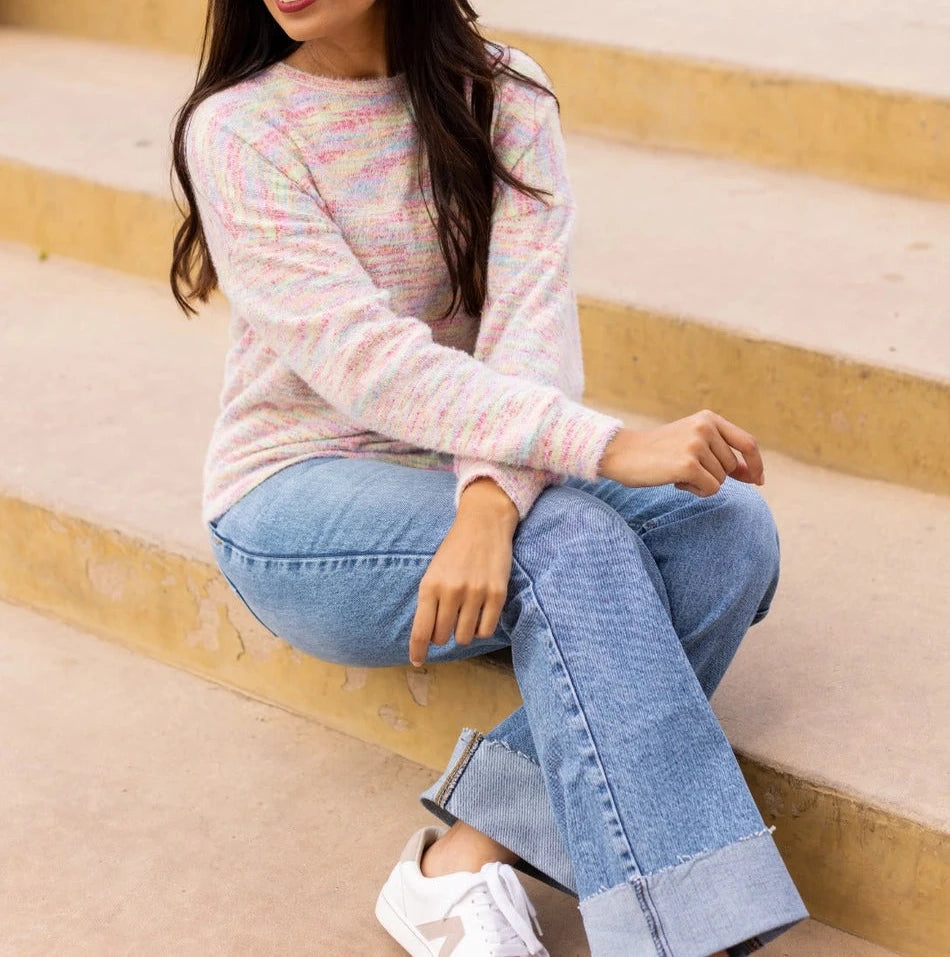 A multicolor Knit Top adds a vibrant, playful touch to your wardrobe. Crafted from a soft and stretchy blend, this top offers all-day comfort. Featuring a relaxed fit and a beautiful heathered multicolor knit design.