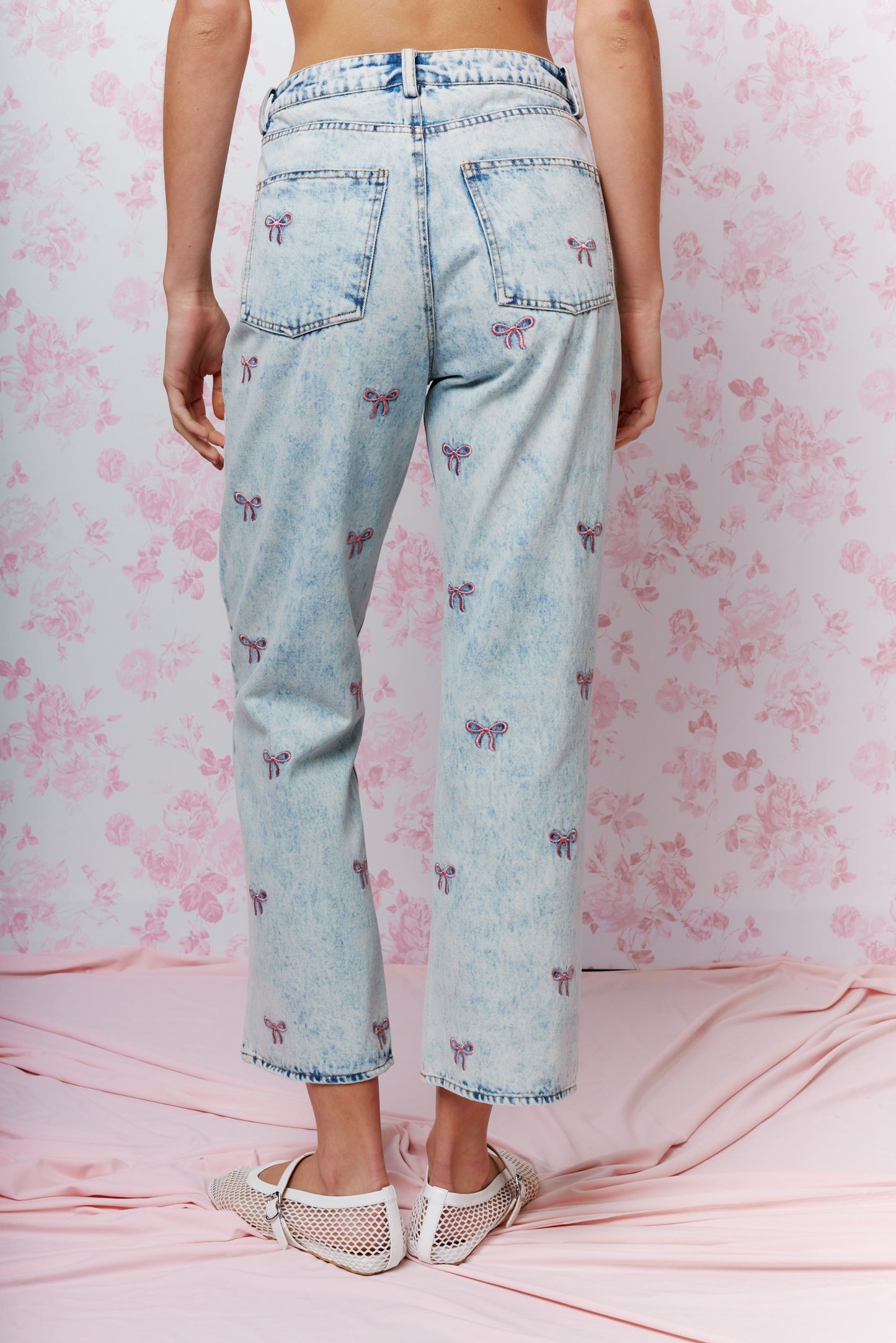 Embroidered Cropped Denim Jeans bring a playful twist to classic denim. Featuring a cropped length and all-over embroidered bow detail.