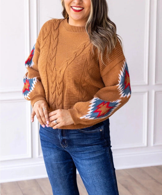 Cable Knit Aztec Sweater brings together cozy warmth and eye-catching design. Featuring a relaxed fit, this sweater is crafted with classic cable-knit detailing on the body and bold Aztec-inspired patterns on the sleeves.