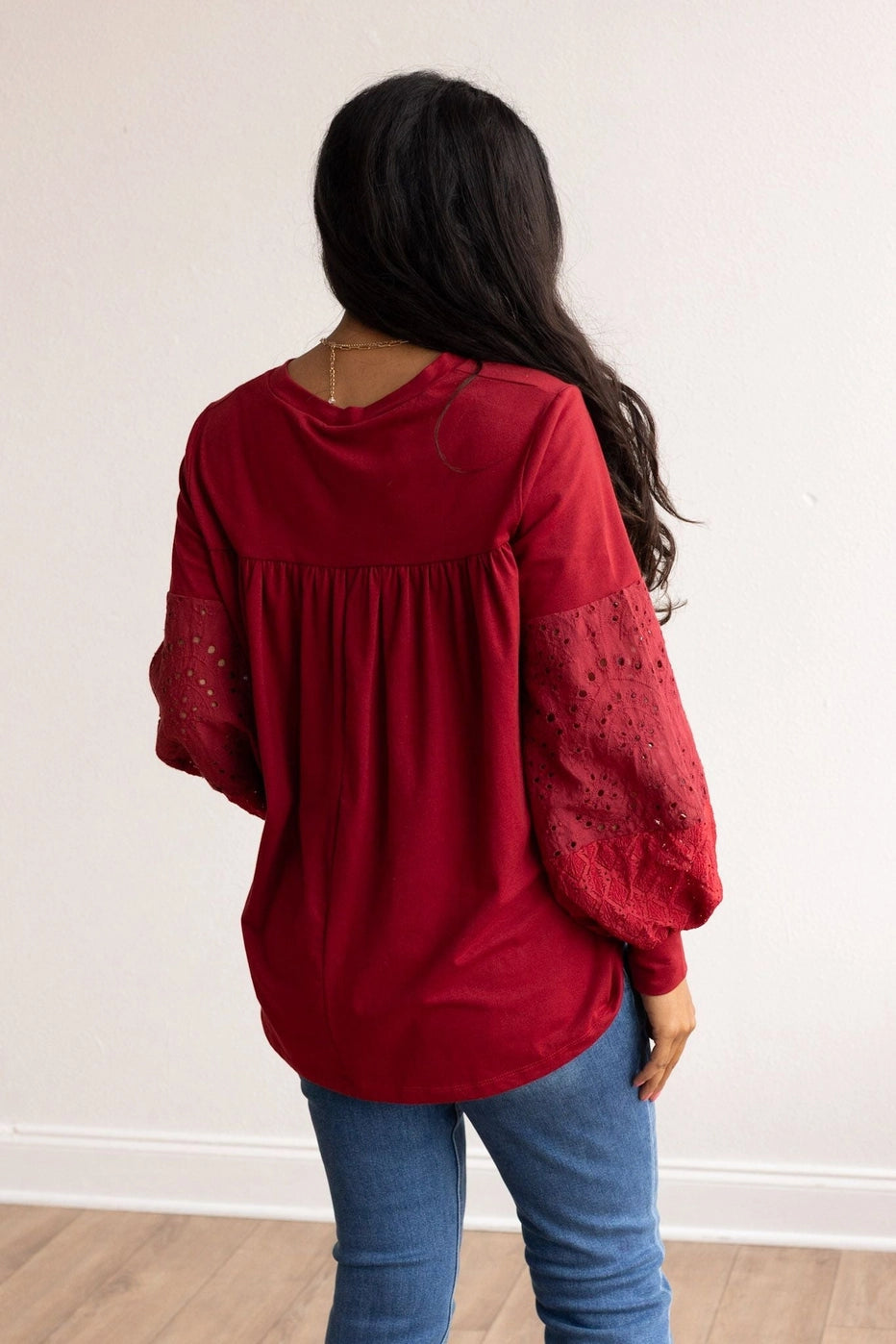 Eyelet Sleeve Top combines casual comfort with a touch of elegance. Designed with a relaxed fit, this top features intricate eyelet lace balloon sleeves.