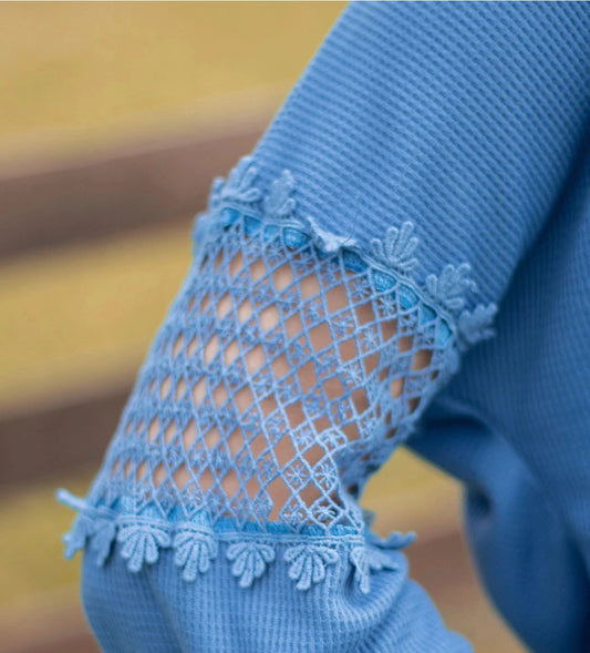 Denim Blue Lace Accent Top is a perfect blend of comfort and style. Featuring delicate lace details on the sleeves and a relaxed fit.