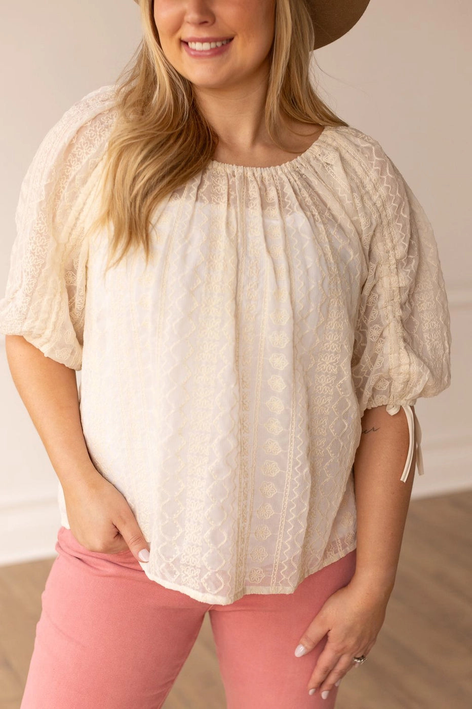 Peasant Blouse exudes effortless charm with its relaxed fit and lightweight feel. Featuring adjustable sleeves and a matching belt crafted from the same fabric.