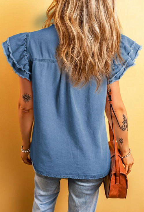 Ruffled Denim Top is a blend of feminine charm and modern style.