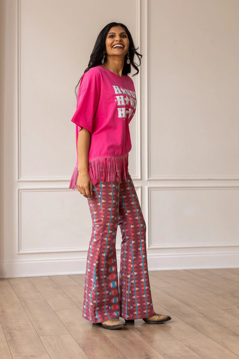 Aztec Flare Pants are a bold and stylish choice, designed to make a statement. These fitted pants feature a vibrant Aztec-inspired pattern and a flattering flared silhouette.