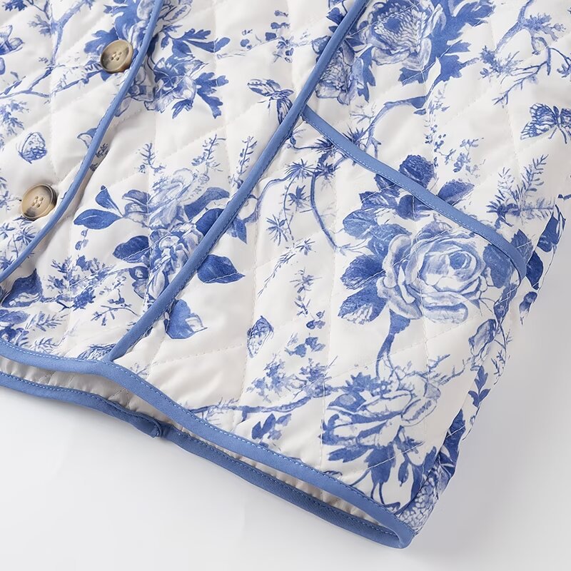 Blue Floral Quilted Jacket is a timeless and elegant piece that offers both style and comfort. Featuring a classic blue-and-white floral pattern, this lightweight quilted jacket is perfect for layering during cooler seasons.