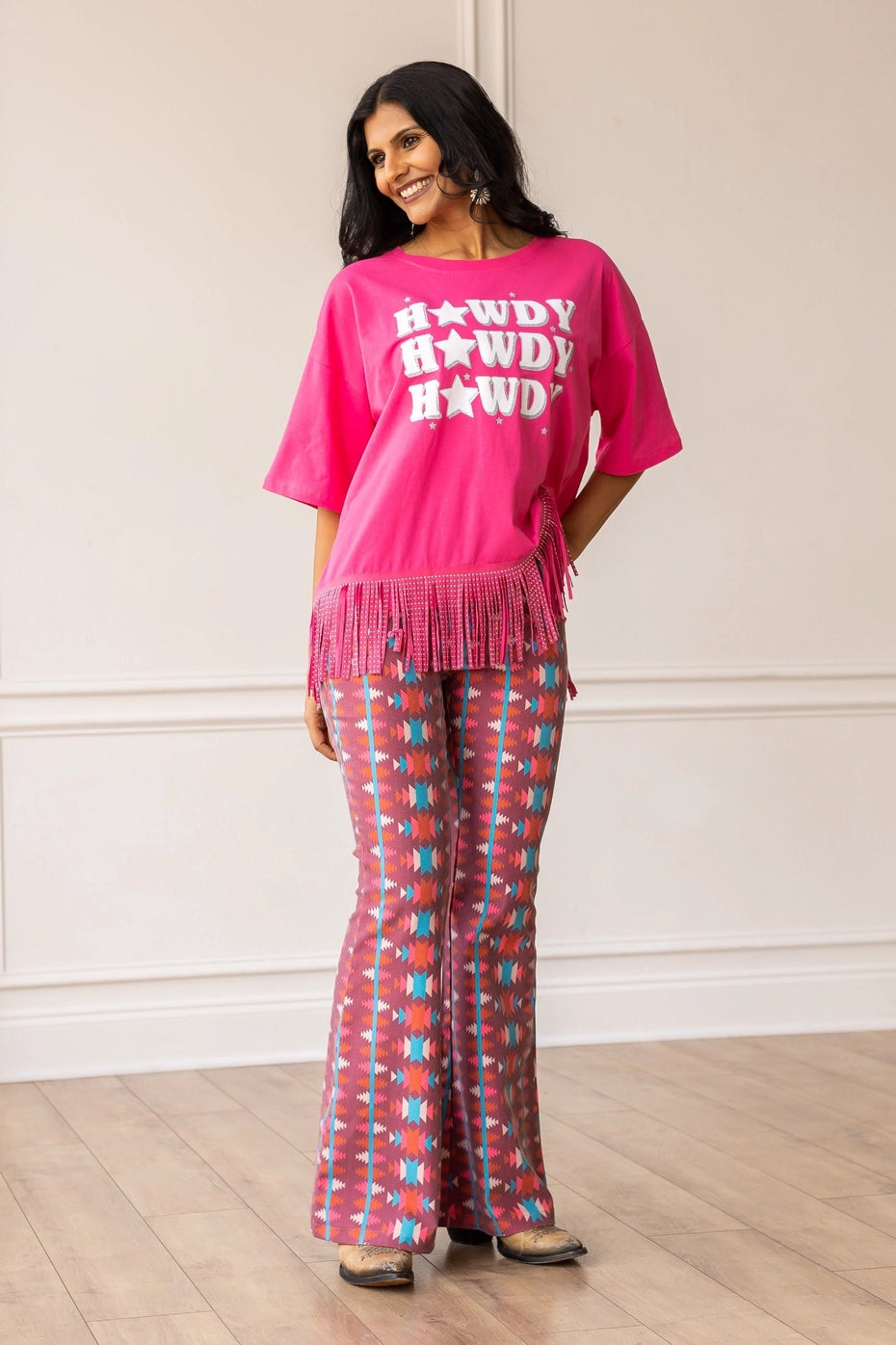 Aztec Flare Pants are a bold and stylish choice, designed to make a statement. These fitted pants feature a vibrant Aztec-inspired pattern and a flattering flared silhouette.