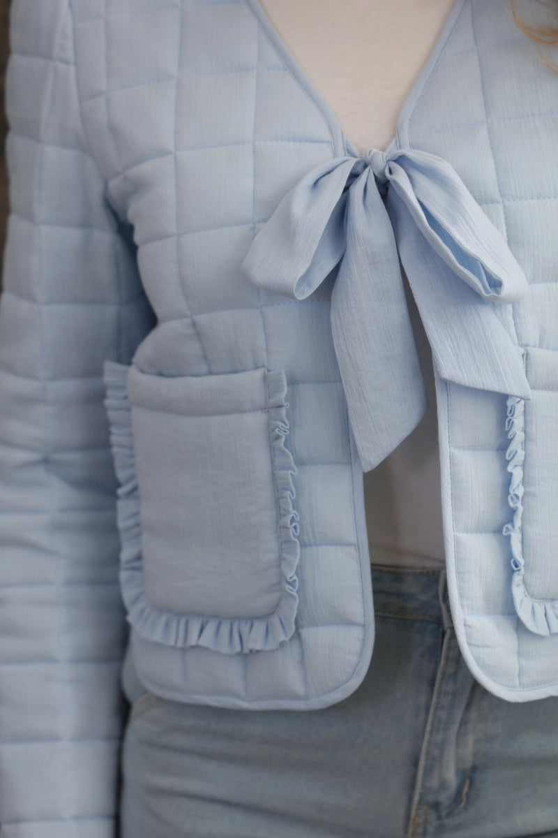 Reversible Quilted Jacket is a versatile and stylish layering piece that combines comfort with timeless charm. Crafted from voile fabric, this jacket features a quilted, patchwork print design and a flattering V-neckline.