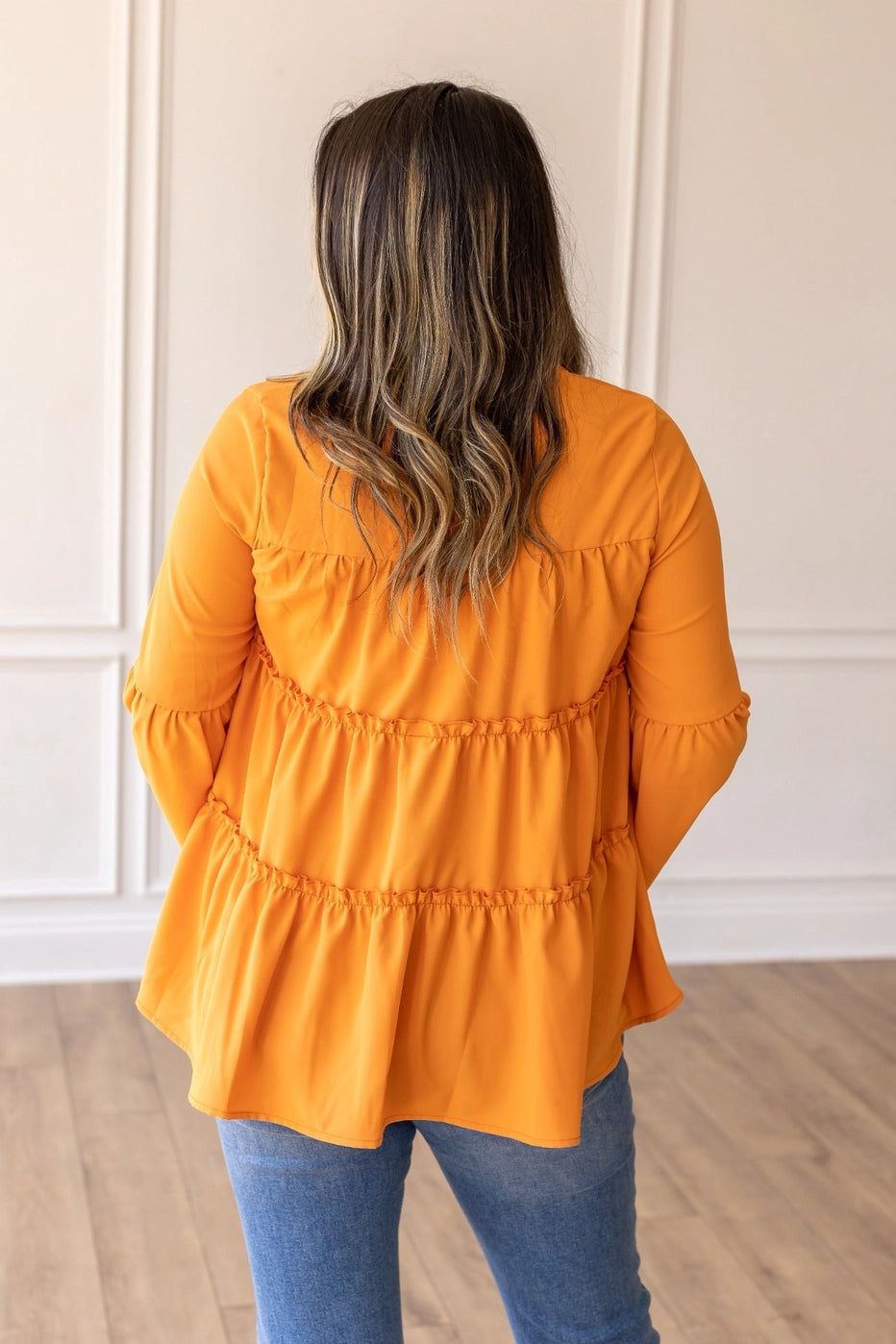 Orange Babydoll Top is a breezy and feminine piece designed for both comfort and style. With its relaxed fit and flowy tiered silhouette.