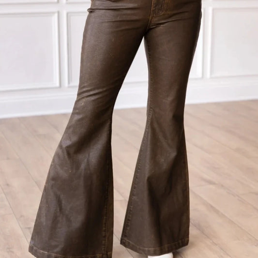 High-Rise Leather Flare Pants are a chic and edgy addition to your wardrobe. Designed with a fitted silhouette through the waist and hips, these pants feature a high-rise waistline, a zipper fly, and a dramatic flared leg.
