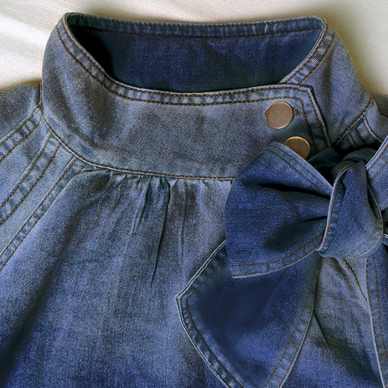 Puff Sleeve Denim Blouse is a stylish and versatile piece that combines casual comfort with a chic design. Featuring 3/4-length loose puff sleeves and a high neckline adorned with a statement bow.