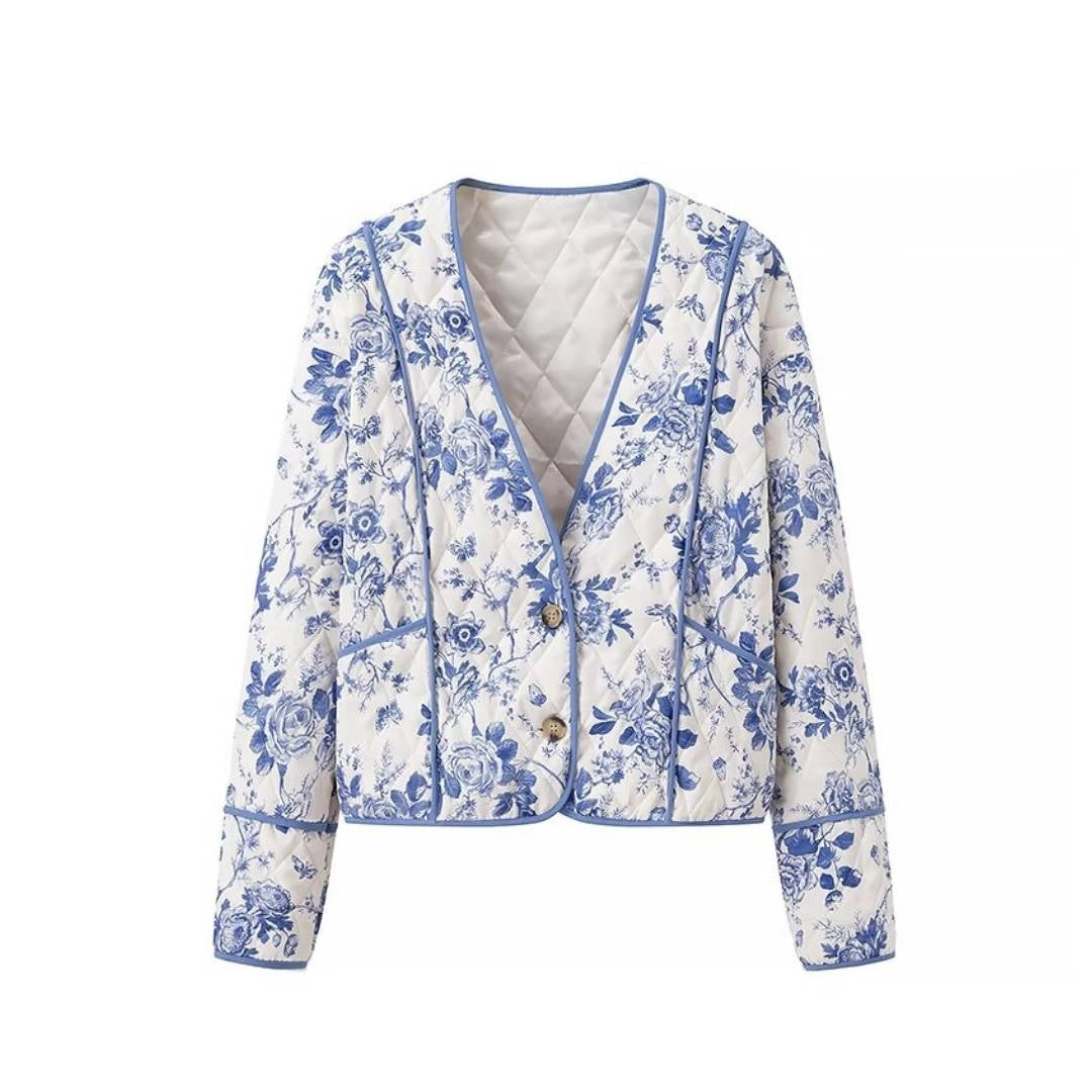 Blue Floral Quilted Jacket is a timeless and elegant piece that offers both style and comfort. Featuring a classic blue-and-white floral pattern, this lightweight quilted jacket is perfect for layering during cooler seasons.