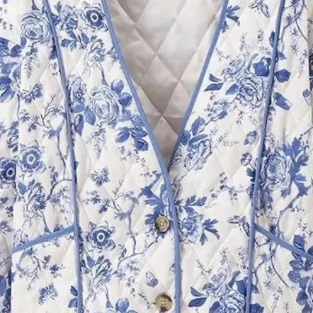 Blue Floral Quilted Jacket is a timeless and elegant piece that offers both style and comfort. Featuring a classic blue-and-white floral pattern, this lightweight quilted jacket is perfect for layering during cooler seasons.