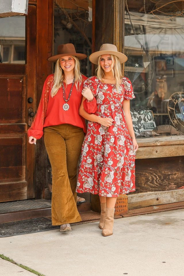 Rust Lace Sleeve V-Neck Top is a perfect balance of casual elegance and comfort. Designed with a relaxed fit and some stretch, this top features a flattering V-neckline and intricate lace inserts on the sleeves.