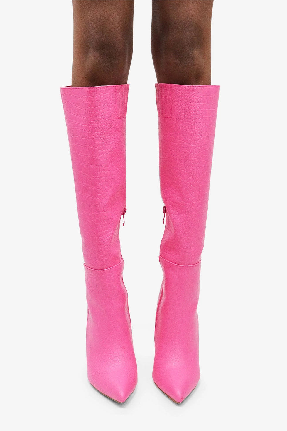 Croc Knee-High Boots are a bold statement piece designed to elevate any outfit. Featuring an eye-catching croc-embossed texture and a vibrant pink hue.