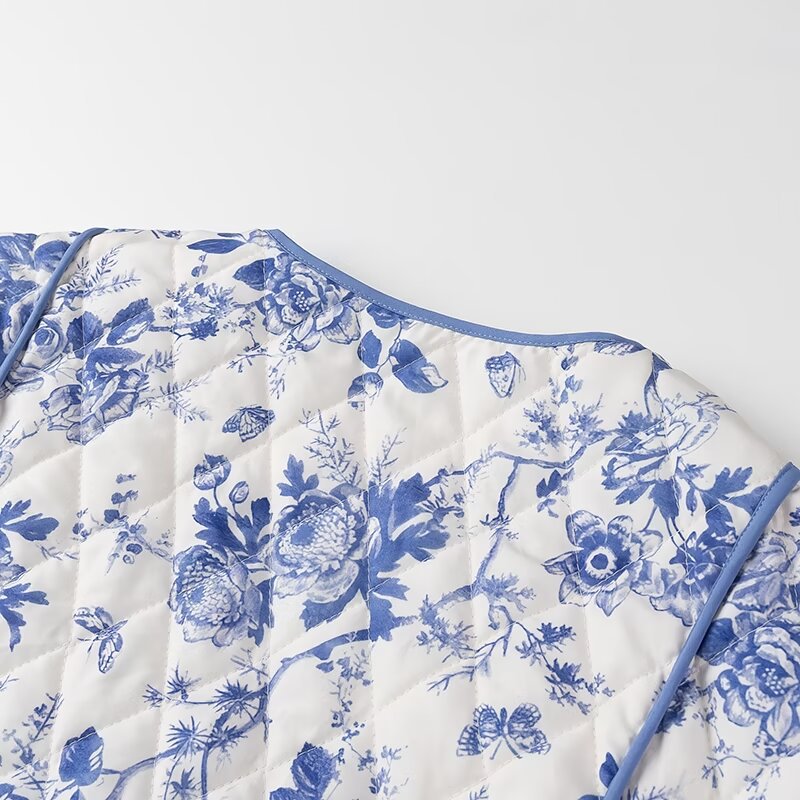 Blue Floral Quilted Jacket is a timeless and elegant piece that offers both style and comfort. Featuring a classic blue-and-white floral pattern, this lightweight quilted jacket is perfect for layering during cooler seasons.