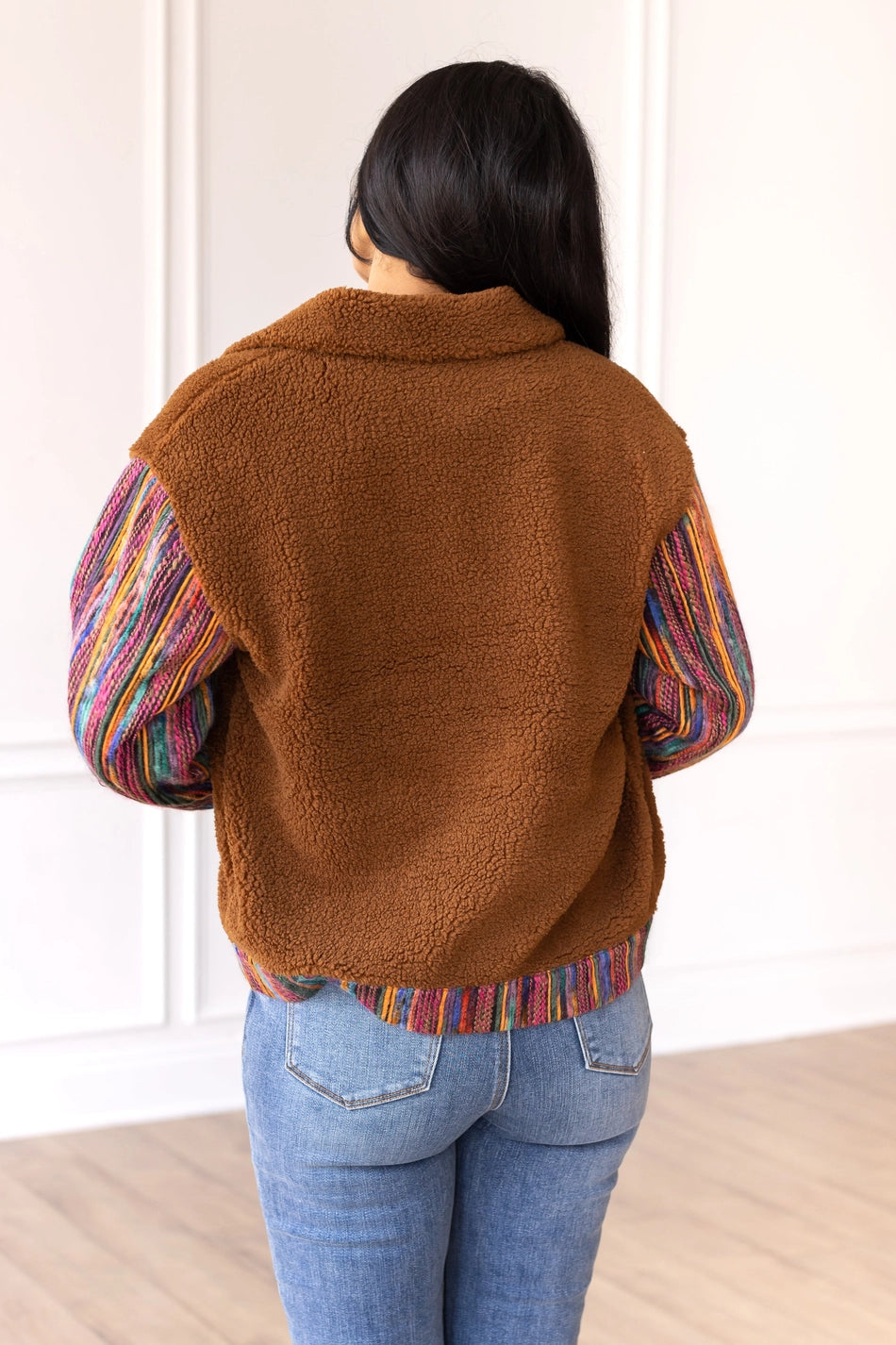 Sherpa Jacket with a cozy and stylish piece that combines comfort with bold, colorful accents.