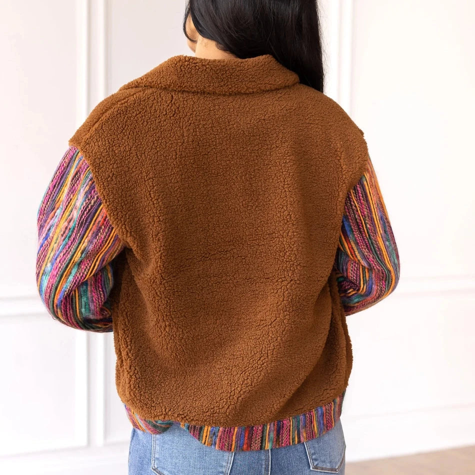 Sherpa Jacket with a cozy and stylish piece that combines comfort with bold, colorful accents.