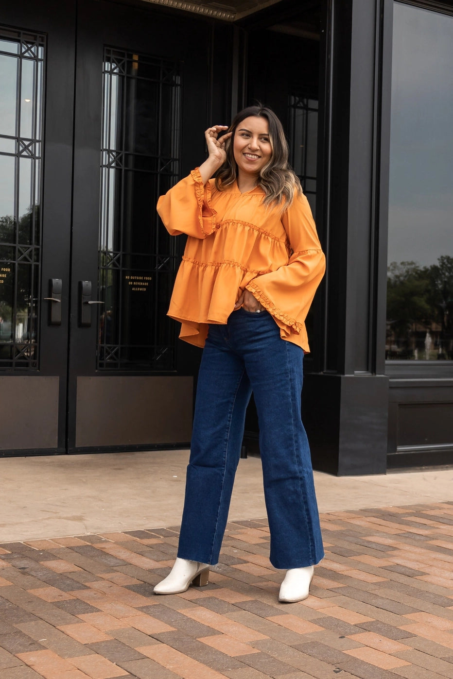 Orange Babydoll Top is a breezy and feminine piece designed for both comfort and style. With its relaxed fit and flowy tiered silhouette.