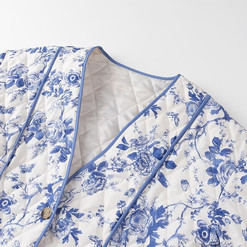 Blue Floral Quilted Jacket is a timeless and elegant piece that offers both style and comfort. Featuring a classic blue-and-white floral pattern, this lightweight quilted jacket is perfect for layering during cooler seasons.