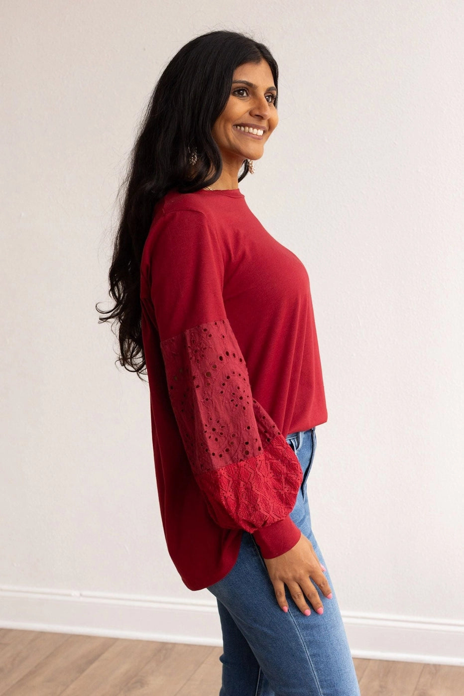 Eyelet Sleeve Top combines casual comfort with a touch of elegance. Designed with a relaxed fit, this top features intricate eyelet lace balloon sleeves.