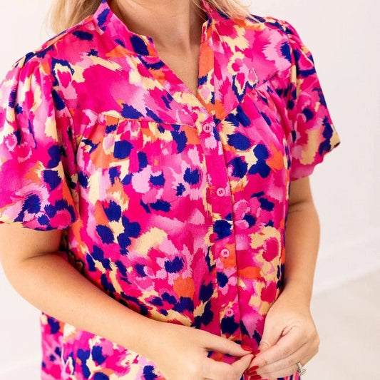 Floral Blouse is a vibrant and stylish addition to your wardrobe. Designed with a button-front closure and chic puff sleeves.