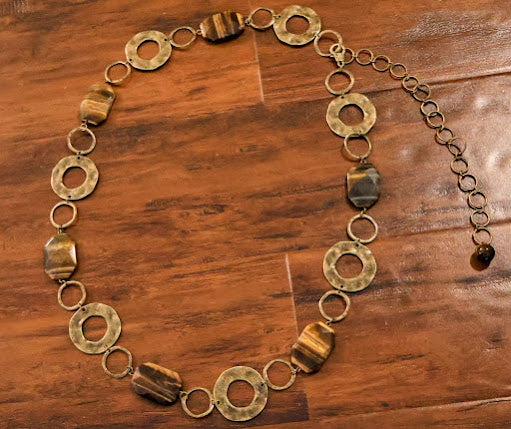 Brass belt on a wooden surface