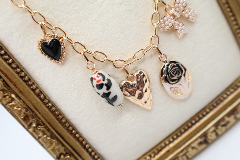 Bow Pendant Necklace is a refined and graceful piece, designed to add a touch of understated elegance to your look. Featuring three petite bow-shaped charms on a delicate gold-tone chain.