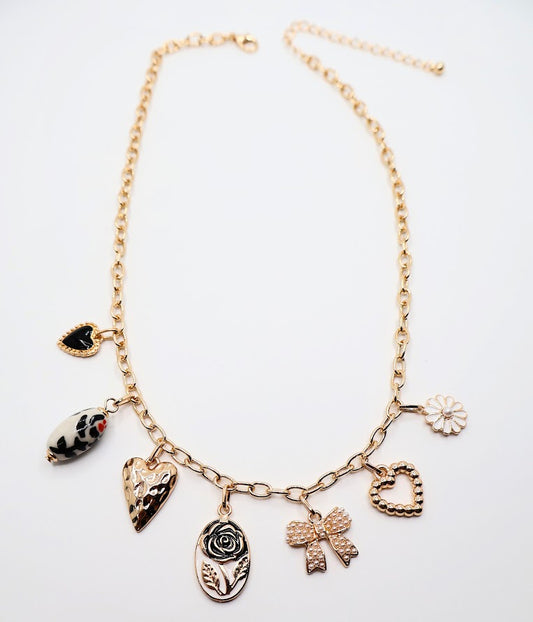Bow Pendant Necklace is a refined and graceful piece, designed to add a touch of understated elegance to your look. Featuring three petite bow-shaped charms on a delicate gold-tone chain.