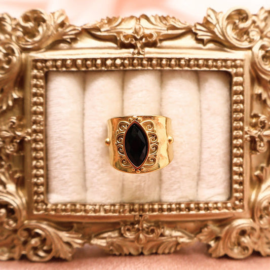 Ring is a radiant celebration of bold elegance and timeless femininity. With a marquise-shaped black stone at its heart.