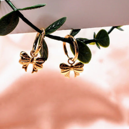 Gold bow-shaped earrings.