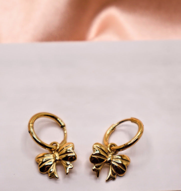 Gold bow-shaped earrings.