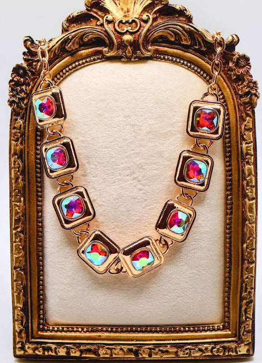 Chunky Necklace with multi-colored gems set in a chic gold-tone design.