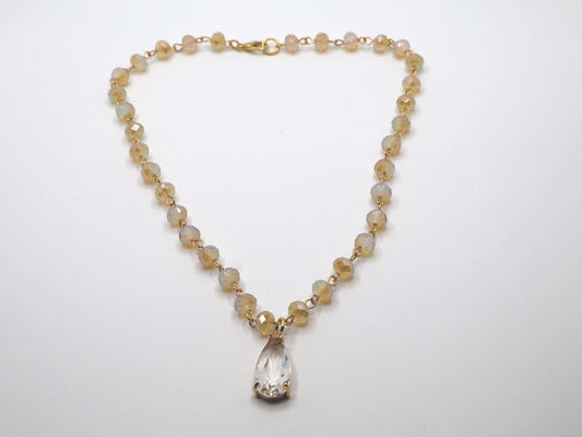 Necklace featuring radiant beads and a stunning teardrop pendant.