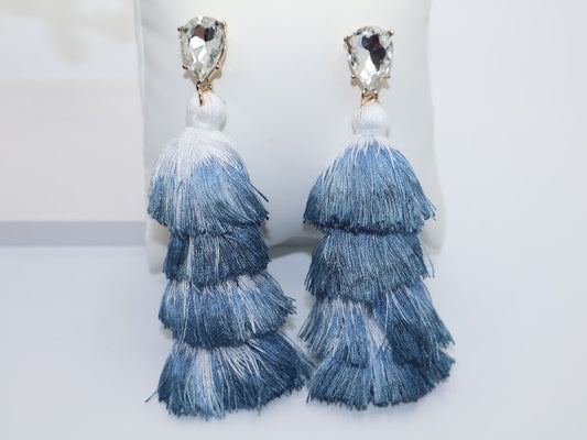 Blue tiered tassel earrings with clear gemstones.