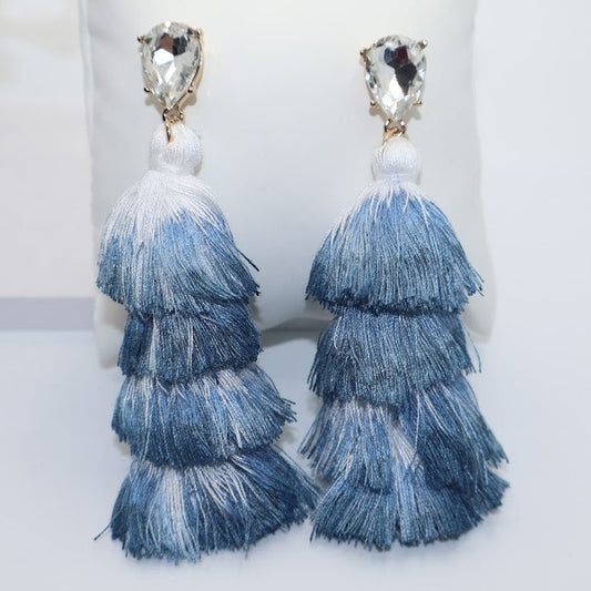 Blue tiered tassel earrings with clear gemstones.