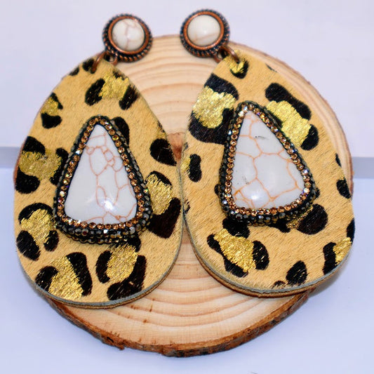 Teardrop earrings combined with bold leopard print and luxurious faux leather.