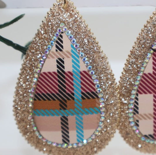 Teardrop-shaped earrings with plaid design and gold glitter accents.
