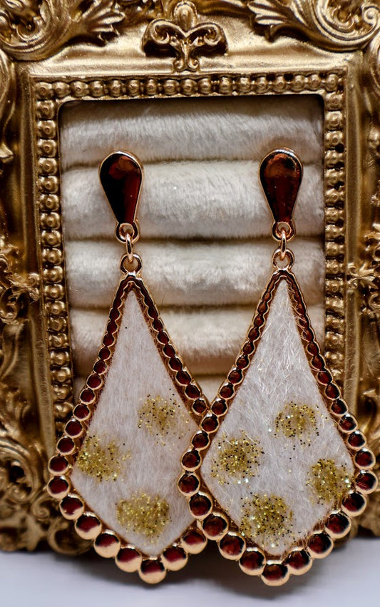 Ivory Gold-Dusted Earrings featuring a stunning ivory-toned teardrop design, delicately dusted with golden floral accents and framed by a shimmering beaded edge.