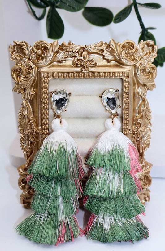 Green and pink tassel earrings feature ayers of vibrant pink and refreshing green tassels, topped with sparkling rhinestone studs.
